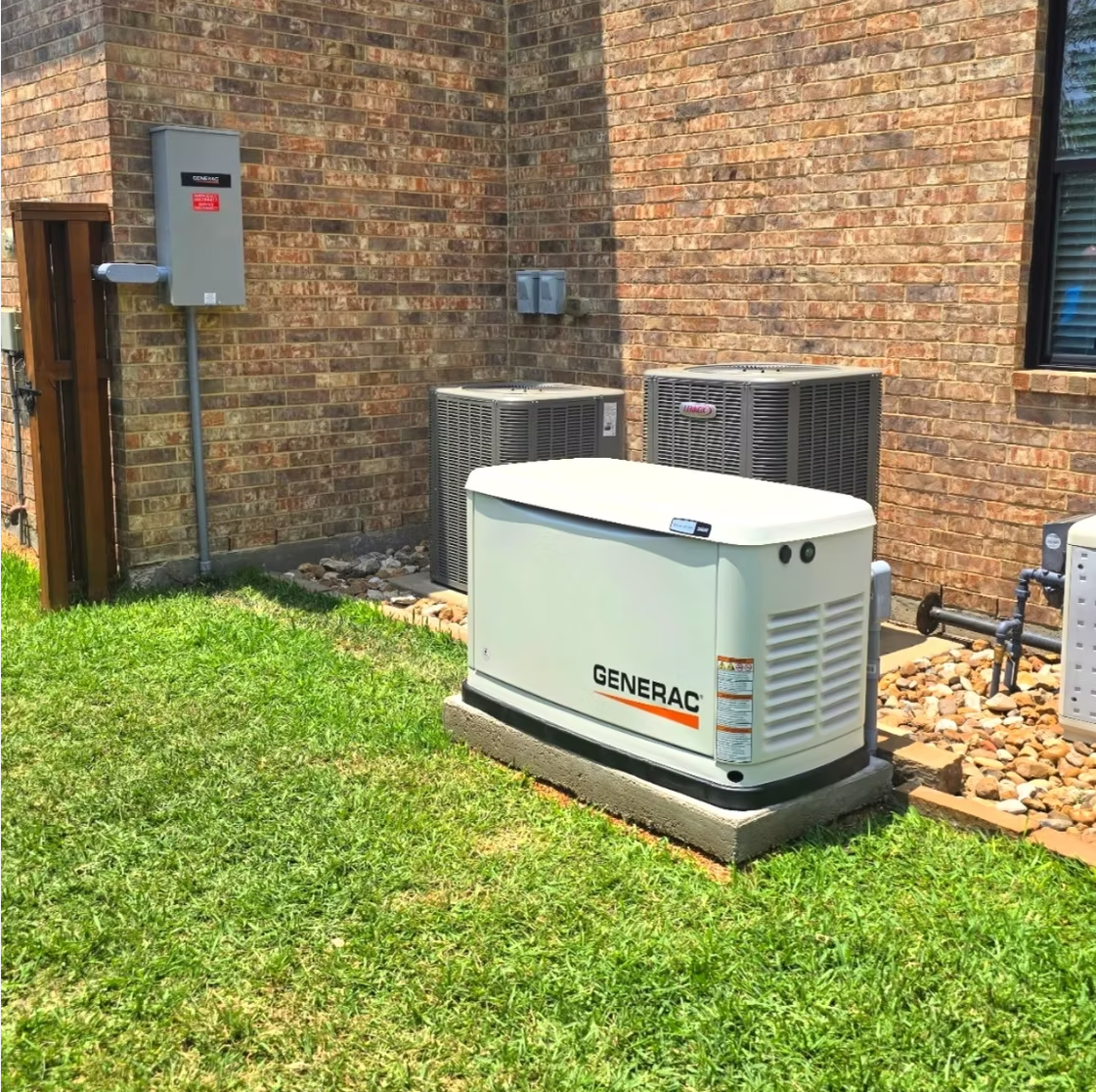 Generac whole-home generator installed next to AC units at Houston home
